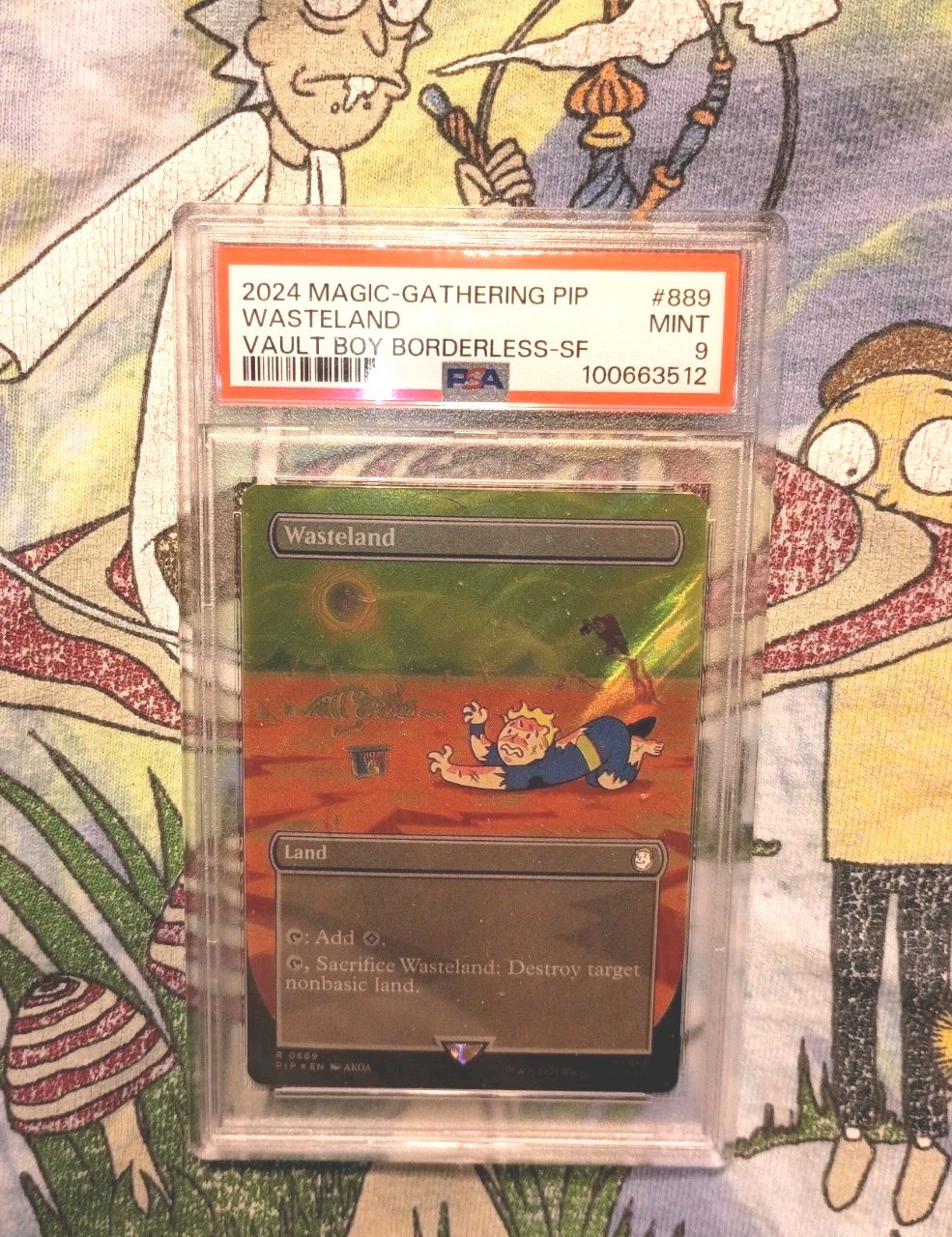 MTG FALLOUT 889 WASTELAND VAULT BOY BORDERLESS SURGE FOIL PSA 9