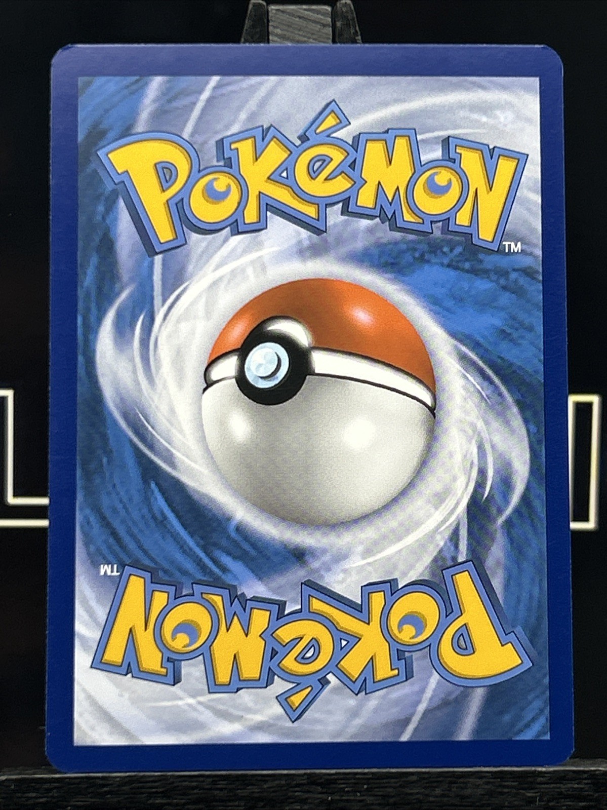 Comfey 063/142 Surging Sparks Reverse Holo Pokémon Card